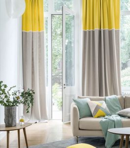 Beautiful yellow, grey, and green-designed room with a beautiful drapes done by Katandra Interiors Busselton.